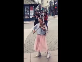 violinist girl playing in the street